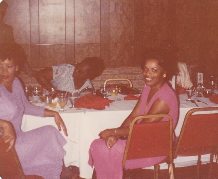 Celia and Cutie at a dinner table