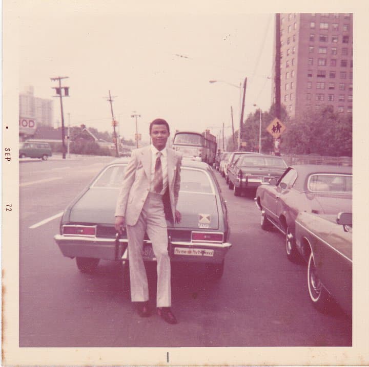 Victor in a suit beside a car, September 1972