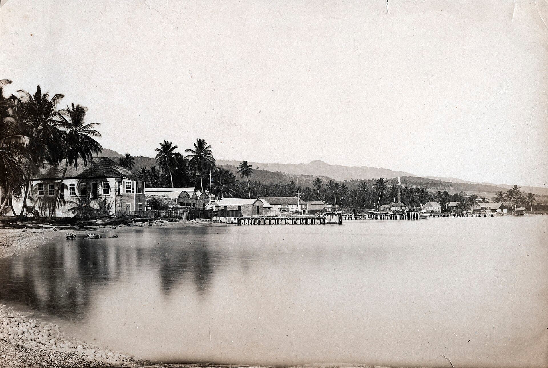St Ann's Bay, Jamaica, photographed around 1900 — sepia shoreline with wharf and hills