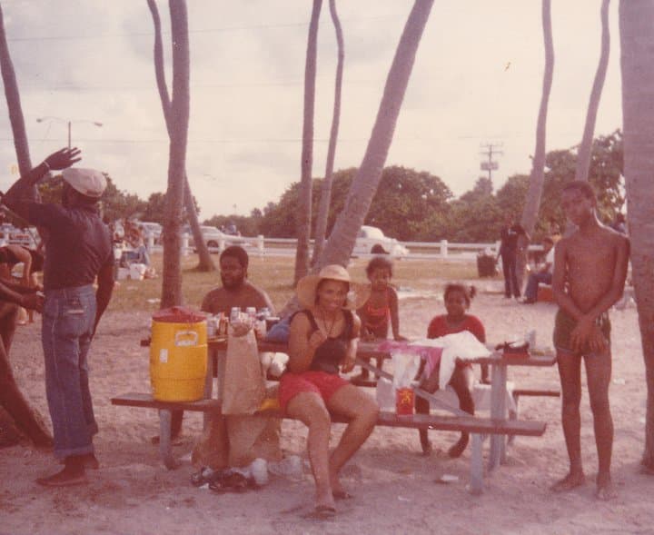 Celia, Roy and Rowan at a picnic by the water